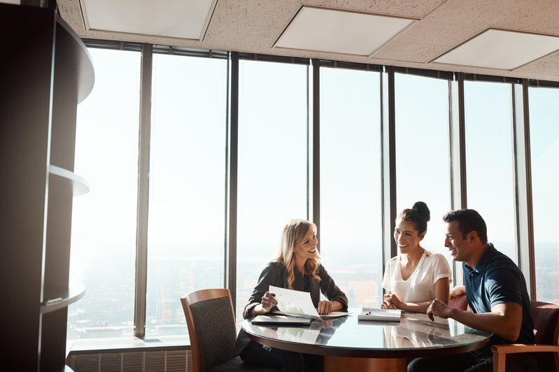 insurance agent meeting with couple