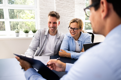 couple talking to insurance agent